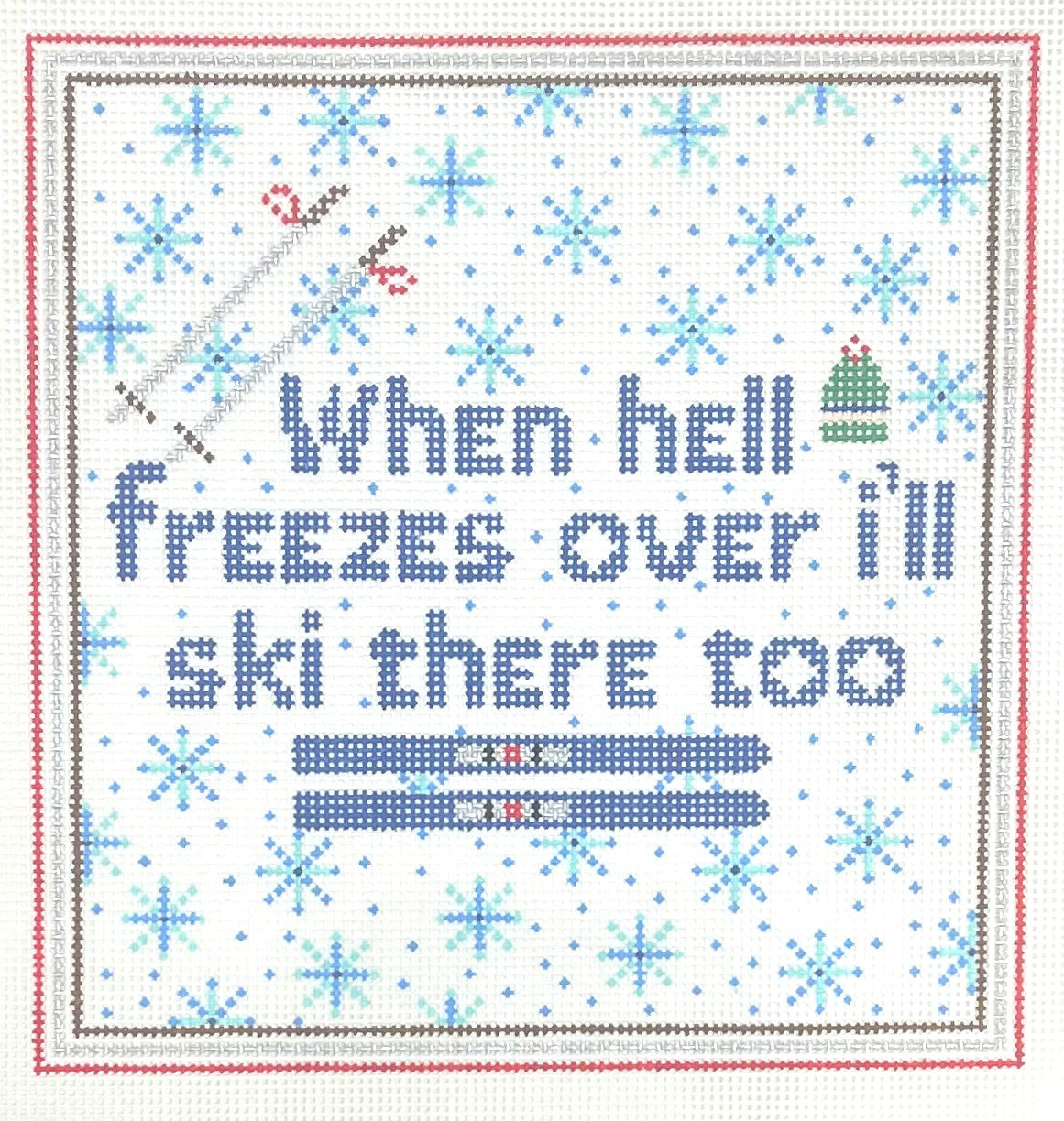 Stitchtent needlepoint canvas with text 'When hell freezes over I'll ski there too' surrounded by snowflakes.