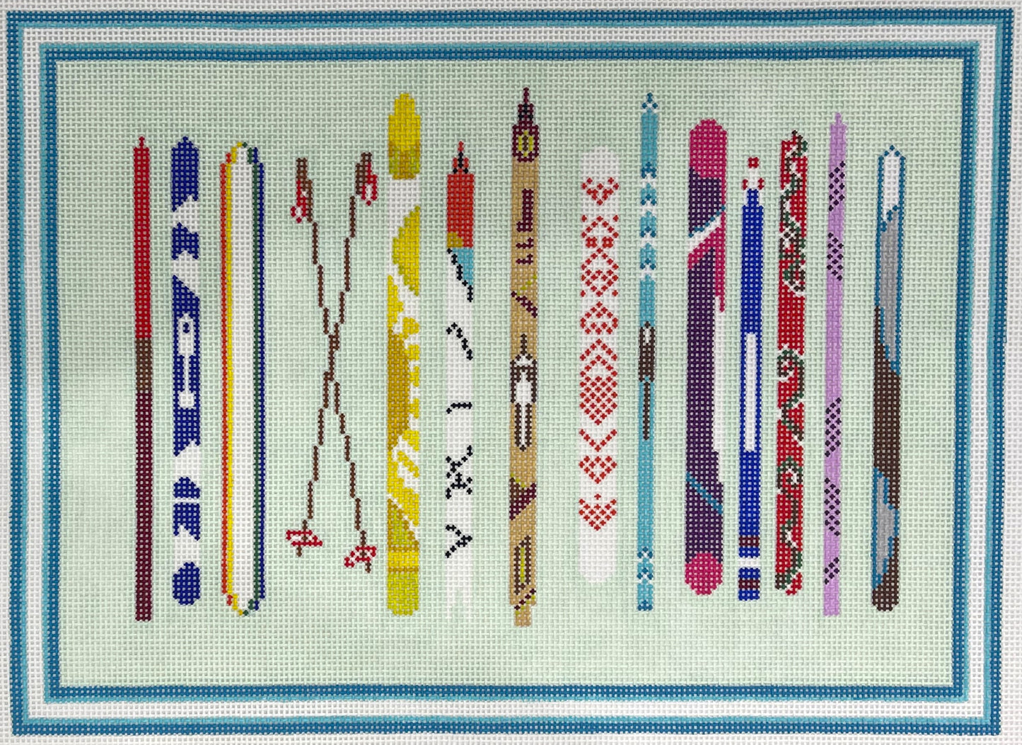 Alice & Blue needlepoint canvas of a collection of stylized skis with various patterns and colors