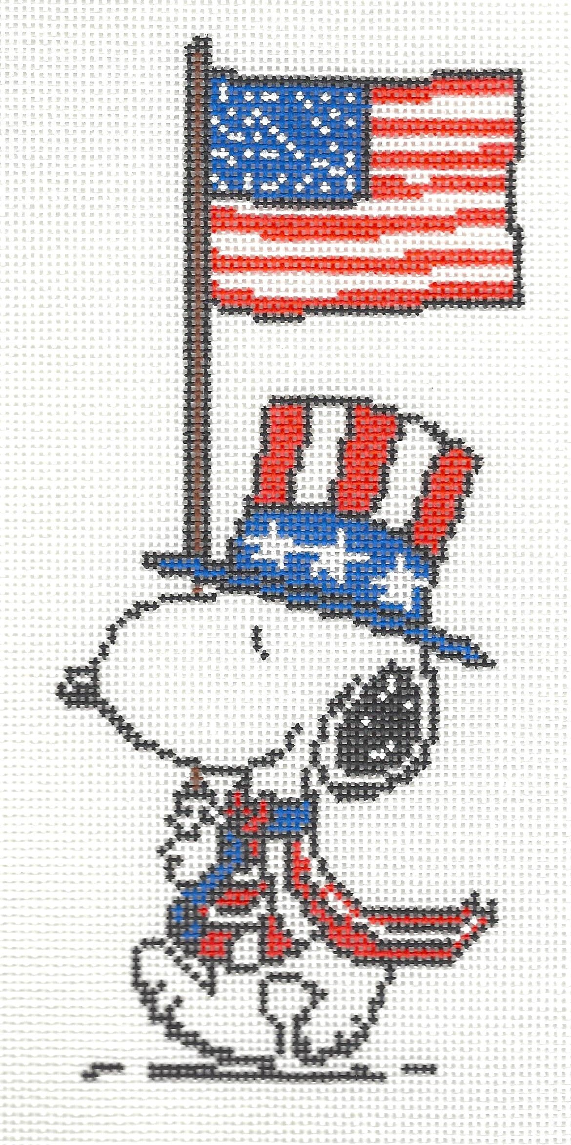Officially Needlepoint canvas of Snoopy wearing a patriotic hat and scarf with an American flag on a white background