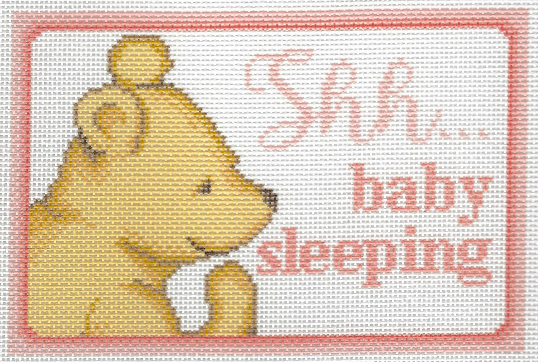 Needlepaint needlepoint canvas of Winnie the Pooh with 'Shh... baby sleeping' text on a white background with light pink border