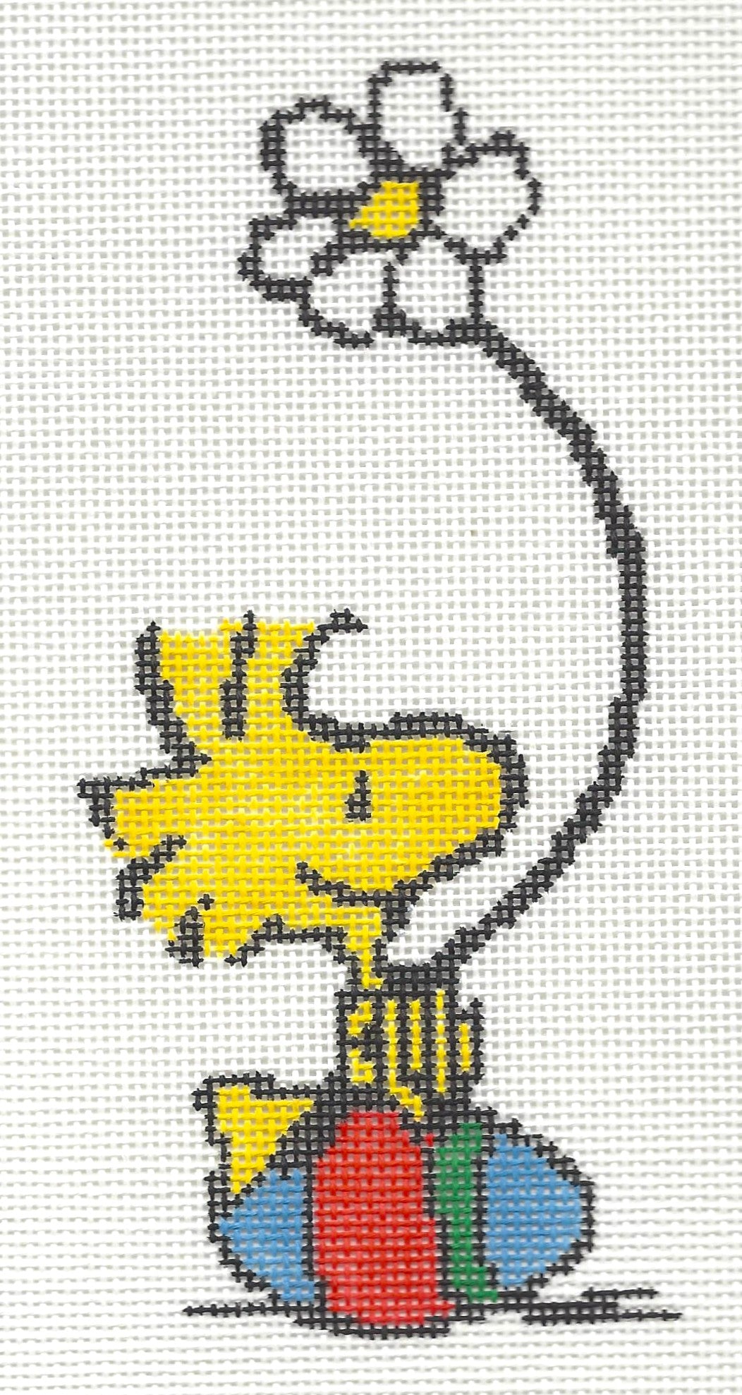 Officially Needlepoint canvas of Woodstock sitting on Easter egg holding a daisy flower