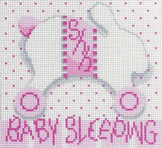 Needlepoint To Go needlepoint canvas of a light gray bunny on wheels silhouette, a white background with pink polka dots, and 'BABY SLEEPING' in pink at the bottom.