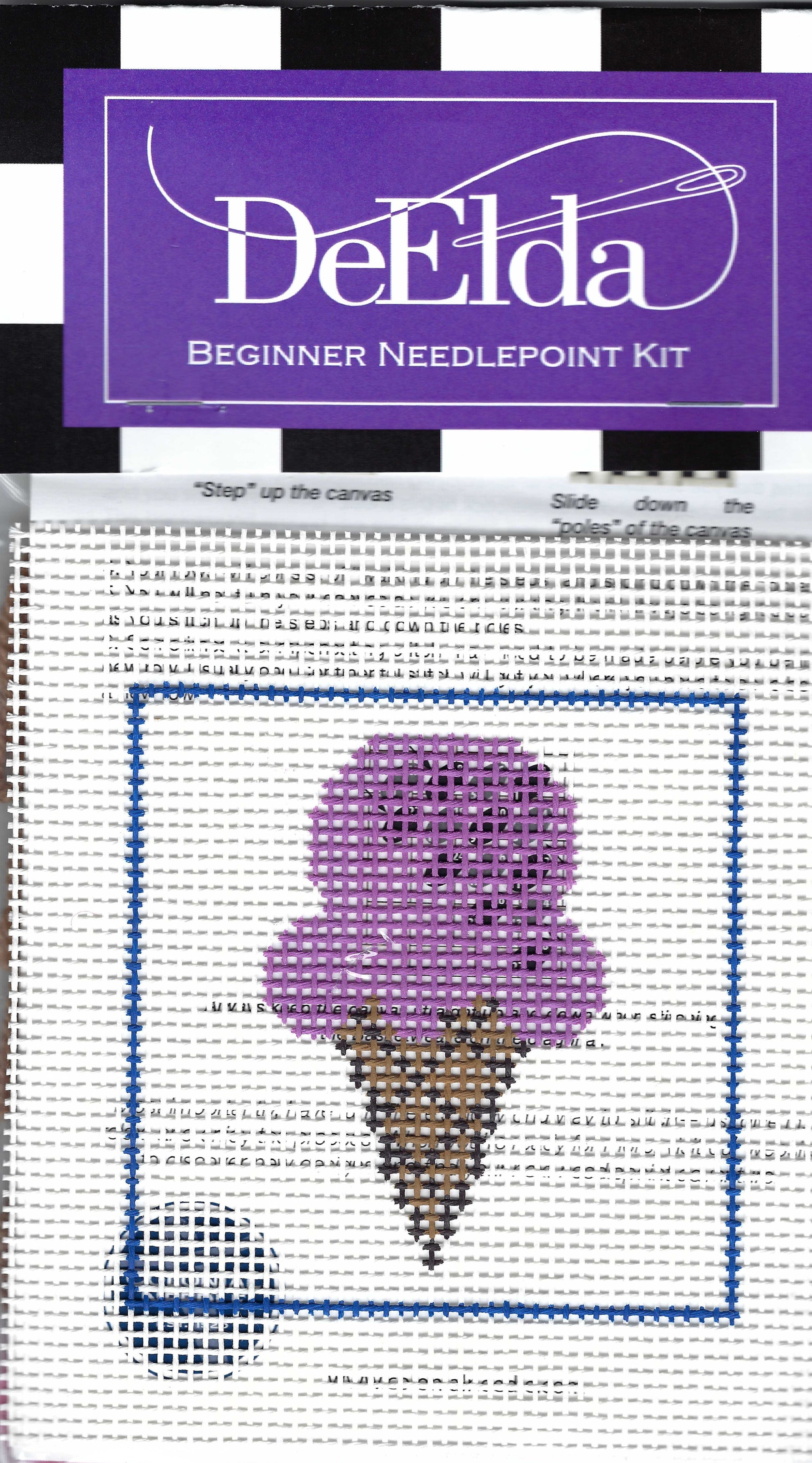 DeElda Beginner Needlepoint Kit featuring an ice cream cone with a brown cone and purple ice cream on a white background.