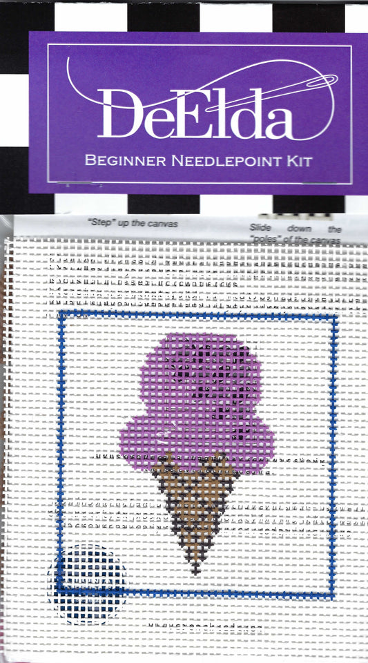 DeElda Beginner Needlepoint Kit featuring an ice cream cone with a brown cone and purple ice cream on a white background.