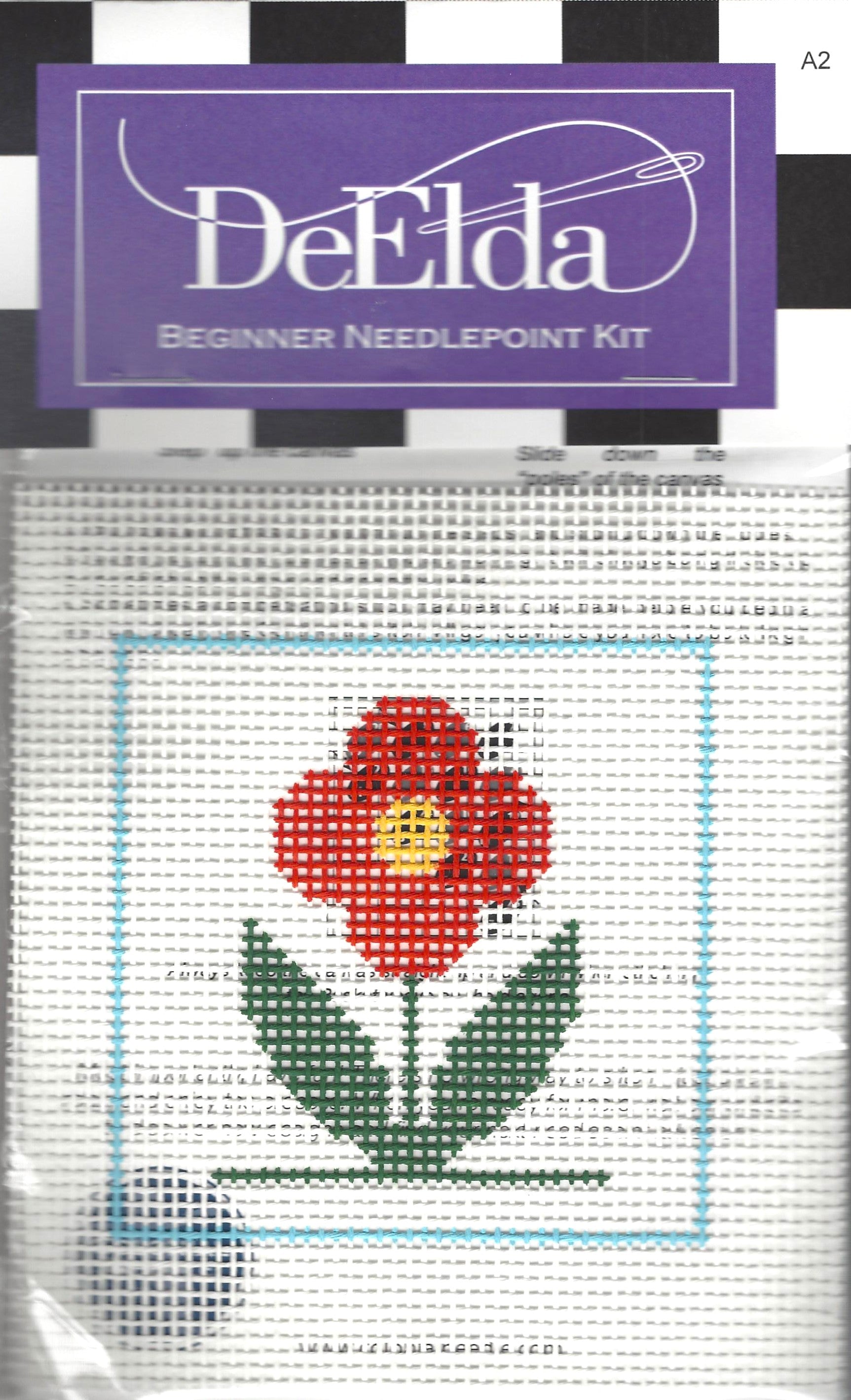 DeElda beginner needlepoint kit with a red flower design on a white background