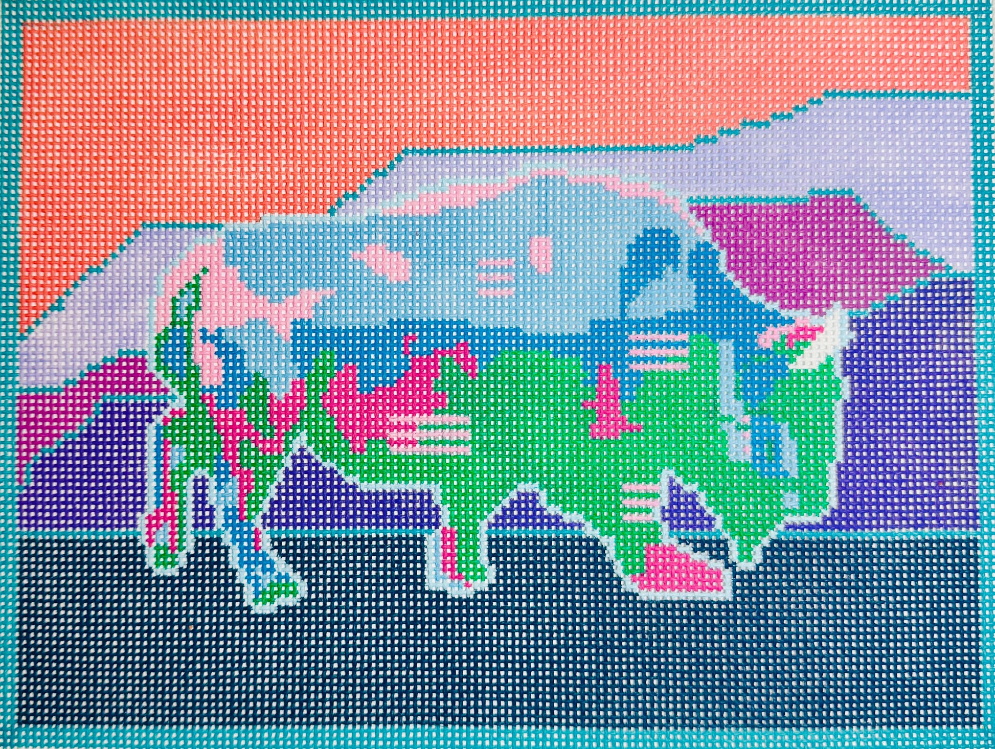 Thorn Alexander needlepoint canvas of a multicolor, patterned bison and landscape with mountains