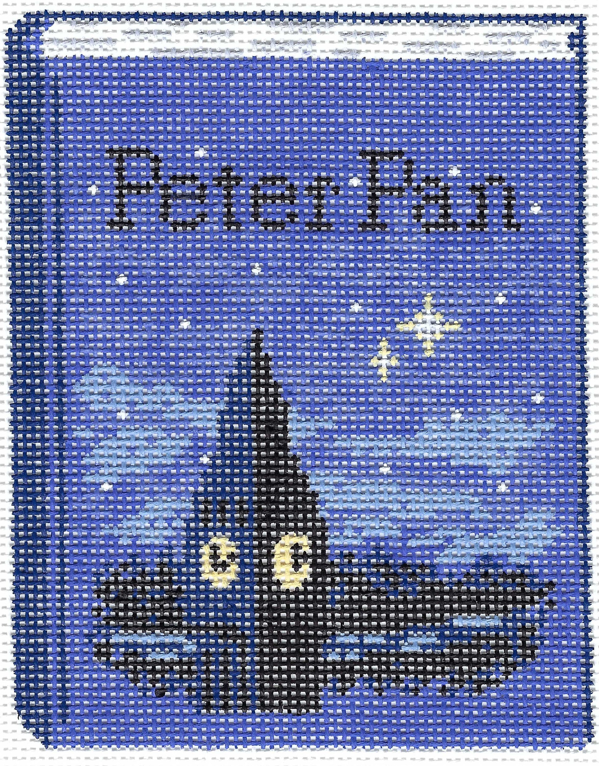 Gingham Stitchery needlepoint canvas of a book cover with a clocktower at night with 'Peter Pan' text.