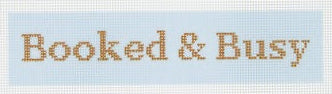 Tilli Tomas Planet Earth needlepoint canvas of bookmark with text 'Booked & Busy' on a light blue background.