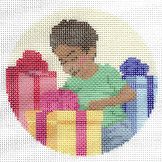 Spellbound Stitchery circular needlepoint canvas featuring an illustration of a child with dark hair in a green shirt opening colorful gift boxes in red, yellow, and blue.