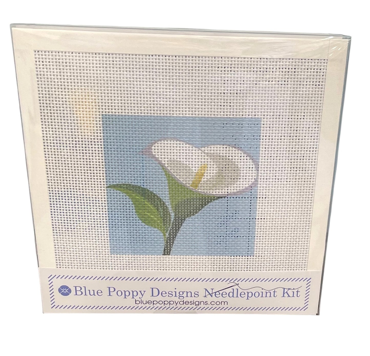 Blue Poppy Designs needlepoint kit with a white calla lily design on a light blue and white background