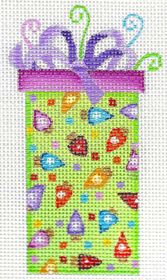 A colorful needlepoint canvas design of a gift box with a purple ribbon and bow, decorated with whimsical cartoon mushrooms and dots on a light green background.