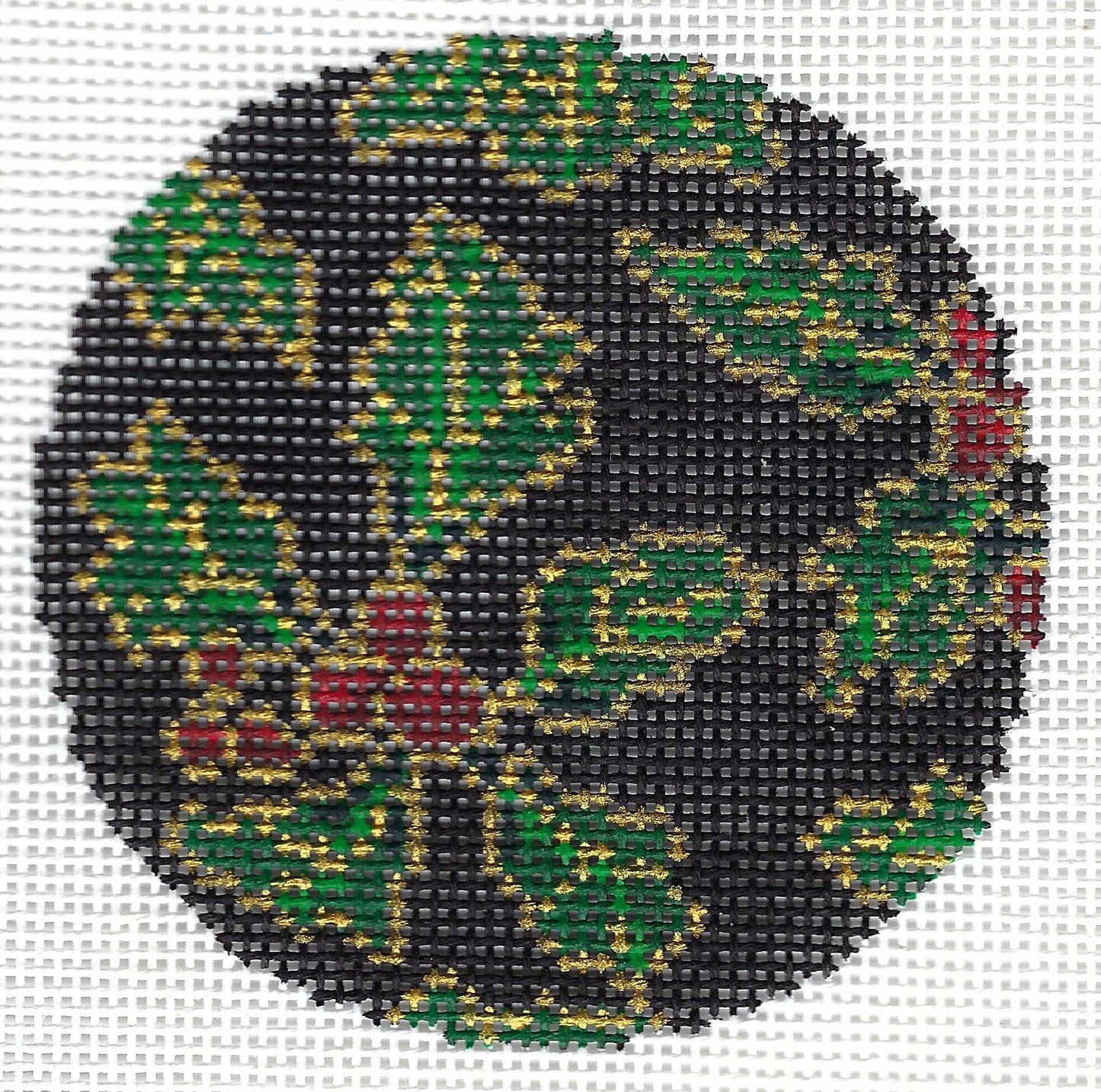 Treglown circular needlepoint canvas featuring a holly design with green leaves, red berries, and gold outlines on a black background.