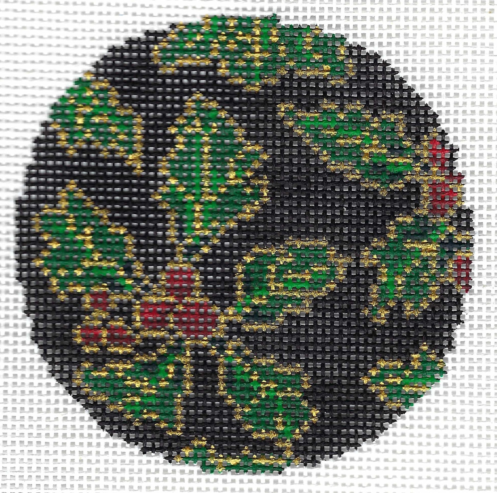 Treglown circular needlepoint canvas featuring a holly design with green leaves, red berries, and gold outlines on a black background.