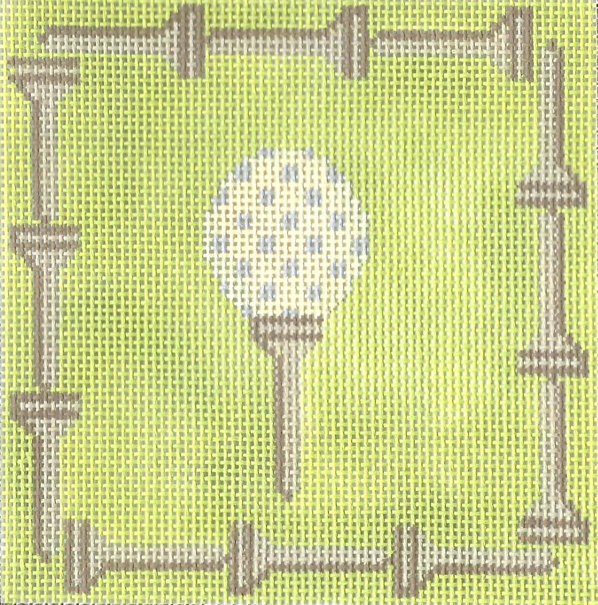 j. childs needlepoint canvas of golf ball on a tee with decorative border of golf tees on green background.