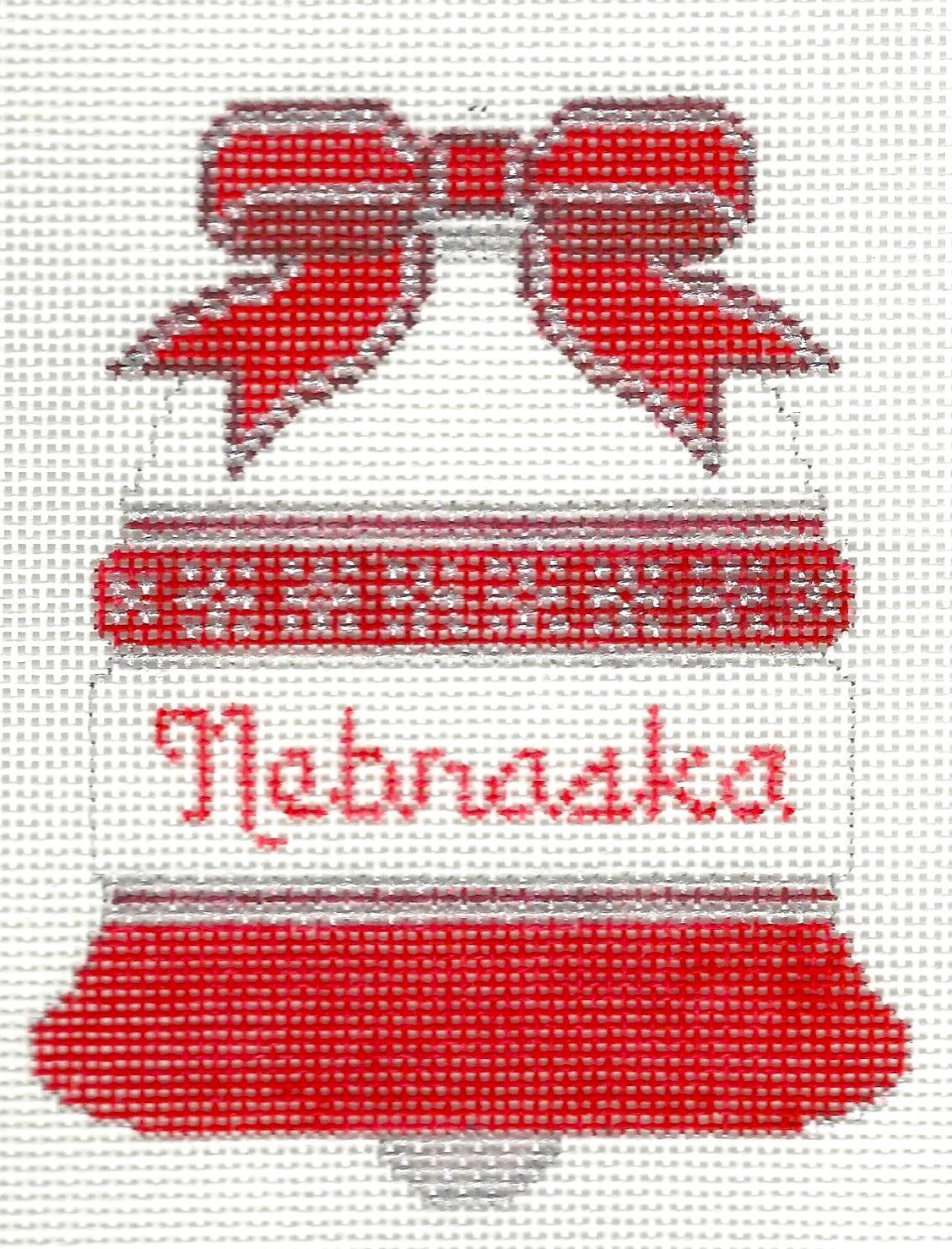J. Malahy Designs needlepoint canvas of a red and white bell with 'Nebraska' text on a white background