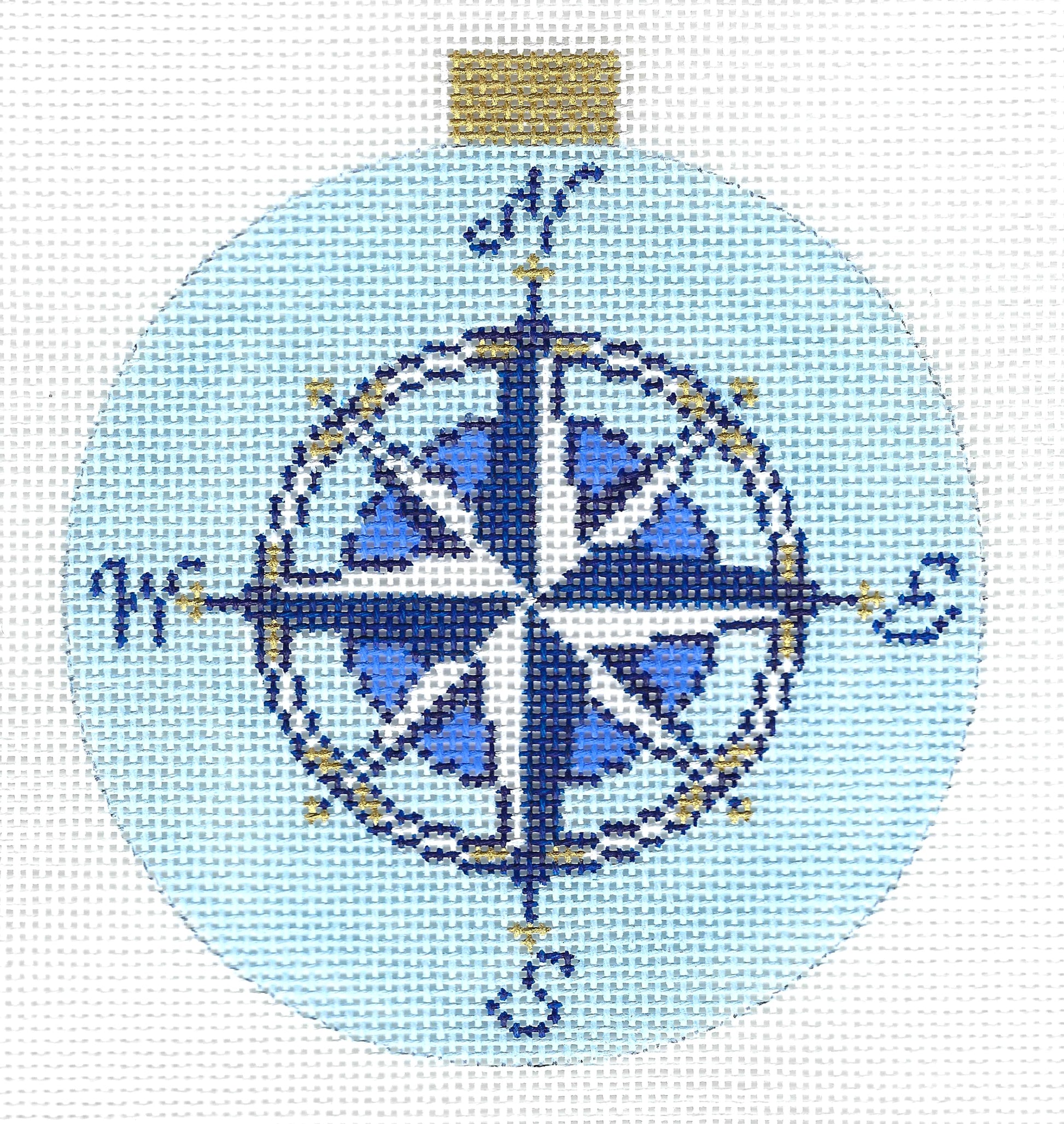 Kirk & Bradley circular needlepoint canvas featuring a compass rose design in shades of blue, white, and gold.