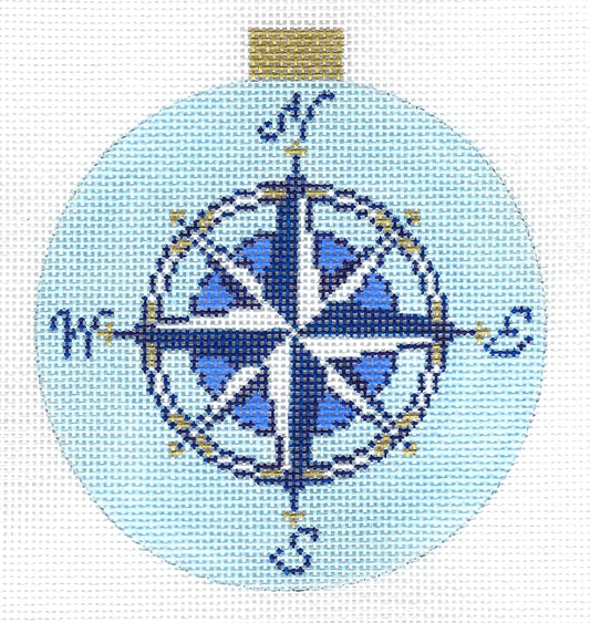 Kirk & Bradley circular needlepoint canvas featuring a compass rose design in shades of blue, white, and gold.