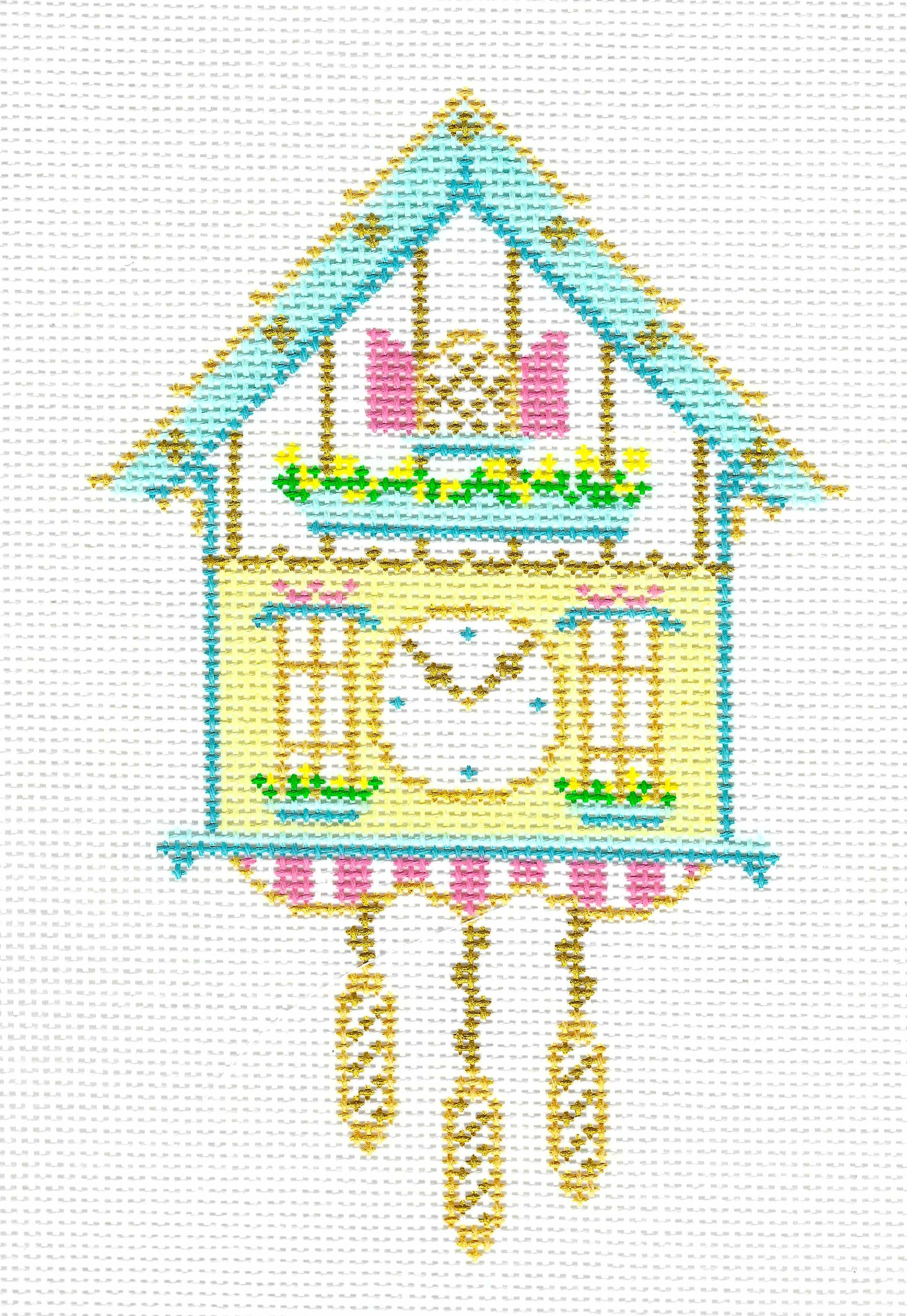 The Plum Stitchery needlepoint canvas of a traditional German cuckoo clock, featuring a light blue roof, pale yellow body, pink windows, and hanging gold weights on a white background.