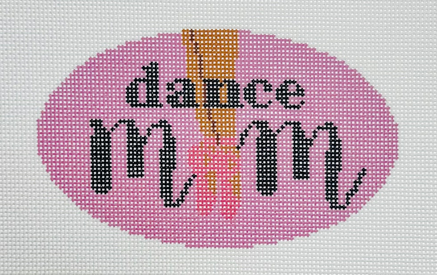 KCN Designers needlepoint canvas of 'Dance Mom' with ballet slippers for the 'O' in 'mom' on a pink background.