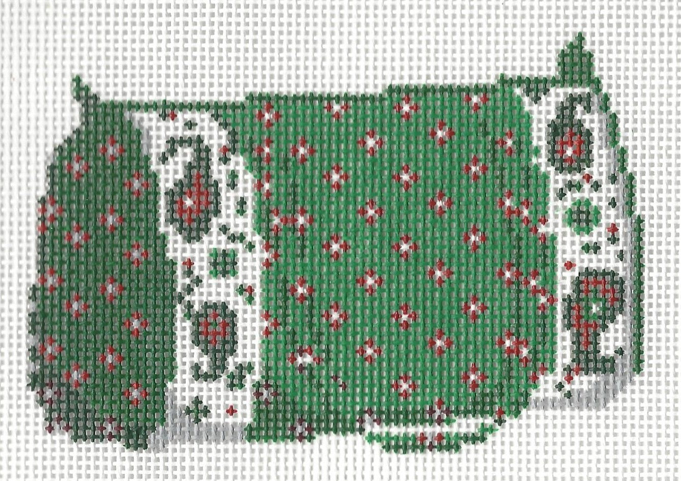 Ann Kaye needlepoint canvas of a green duffle bag with red and white floral patterns on a white background