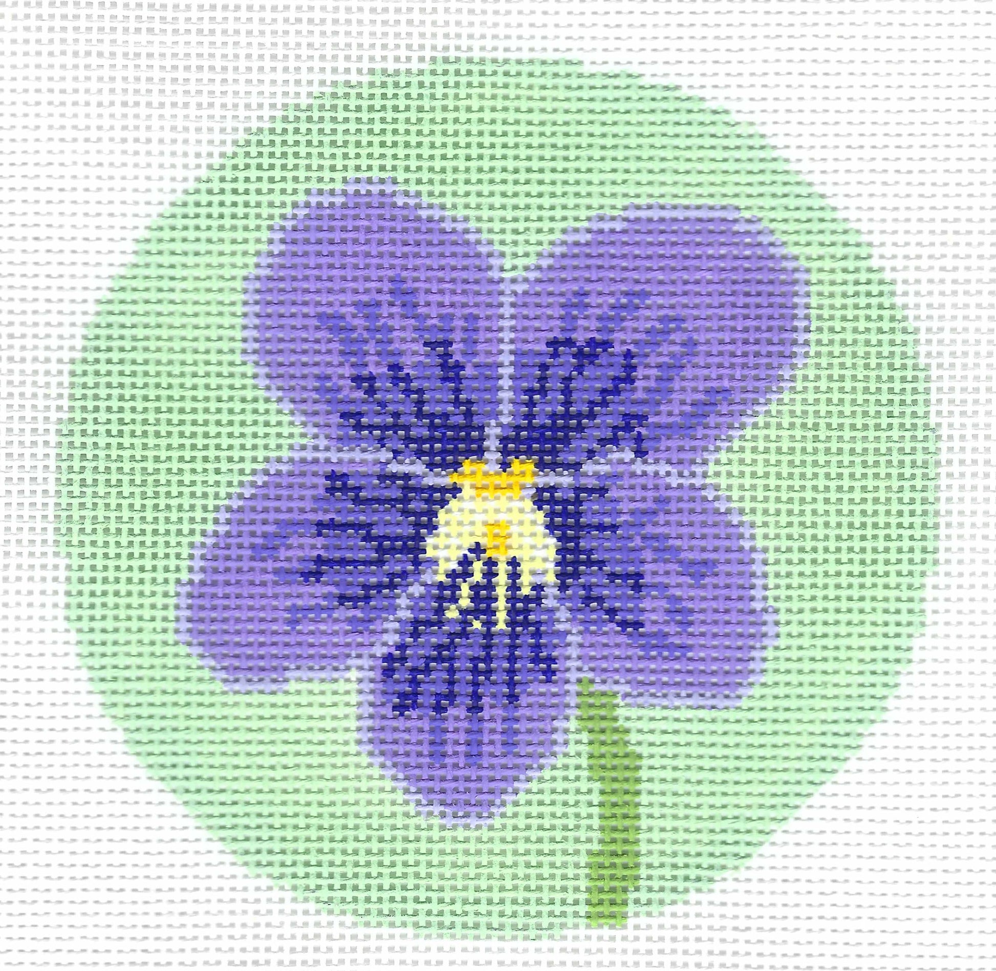 Lucky Lotus needlepoint canvas of a purple violet flower on a green background.