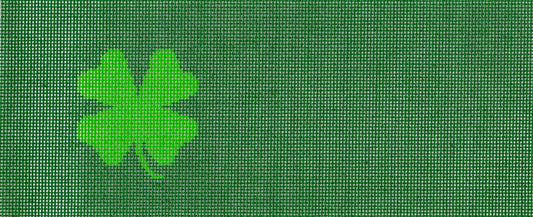 Needlepaint needlepoint canvas of a green four-leaf clover icon on a dark green background.