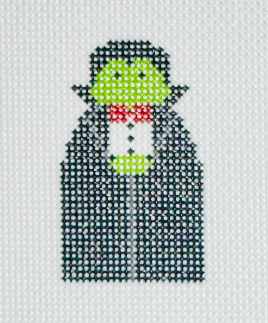 KCN Designers needlepoint canvas of a Georgette's Angel of Dracula with a long black cape, red bowtie, and green skin