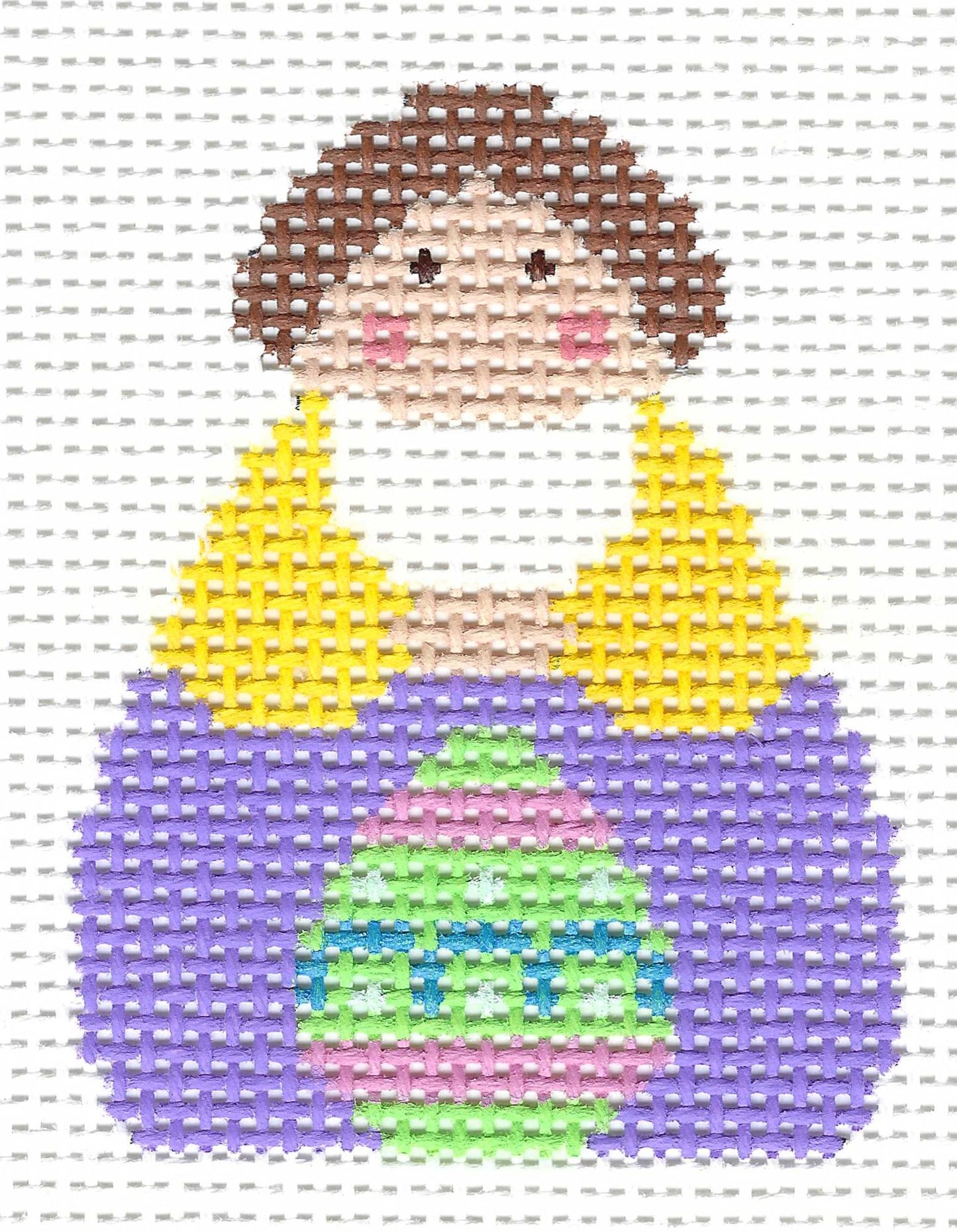 Stitch-Its needlepoint canvas of an Easter Georgettes angel in a yellow and purple dress with a green, pink, blue Easter egg