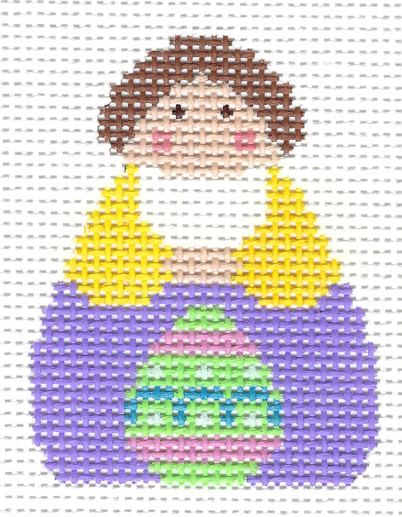 Stitch-Its needlepoint canvas of an Easter Georgettes angel in a yellow and purple dress with a green, pink, blue Easter egg