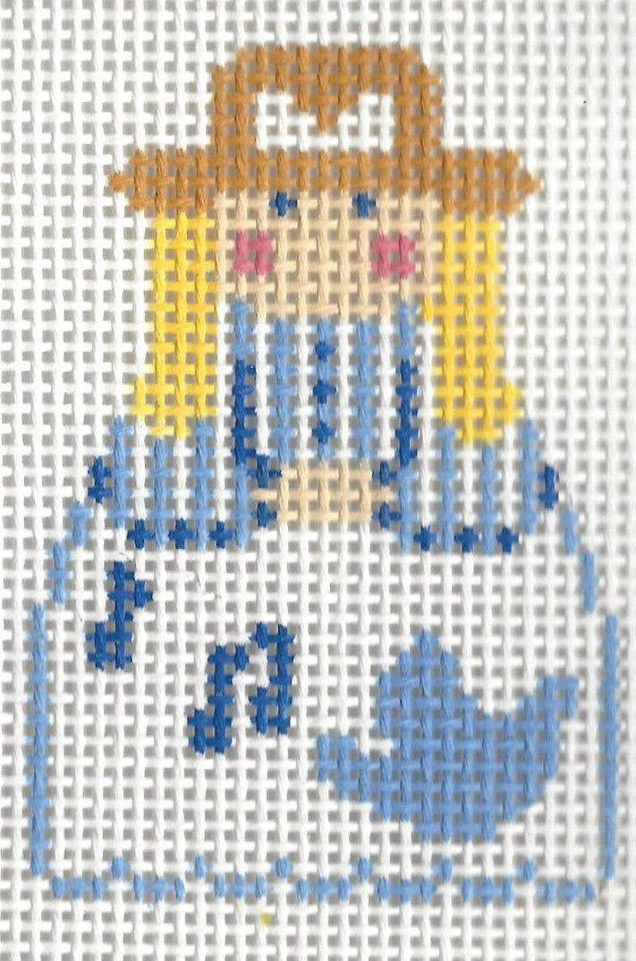 KCN Designers needlepoint canvas of a Georgette's Angel in white dress with light blue outline and a bird on it with music notes.