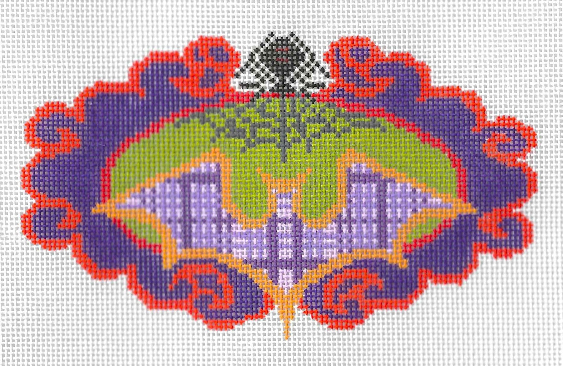 Blueberry Point Canvas needlepoint canvas of a decorative purple plaid bat with gold outline in a central green leaf-like shape with red and purple border.