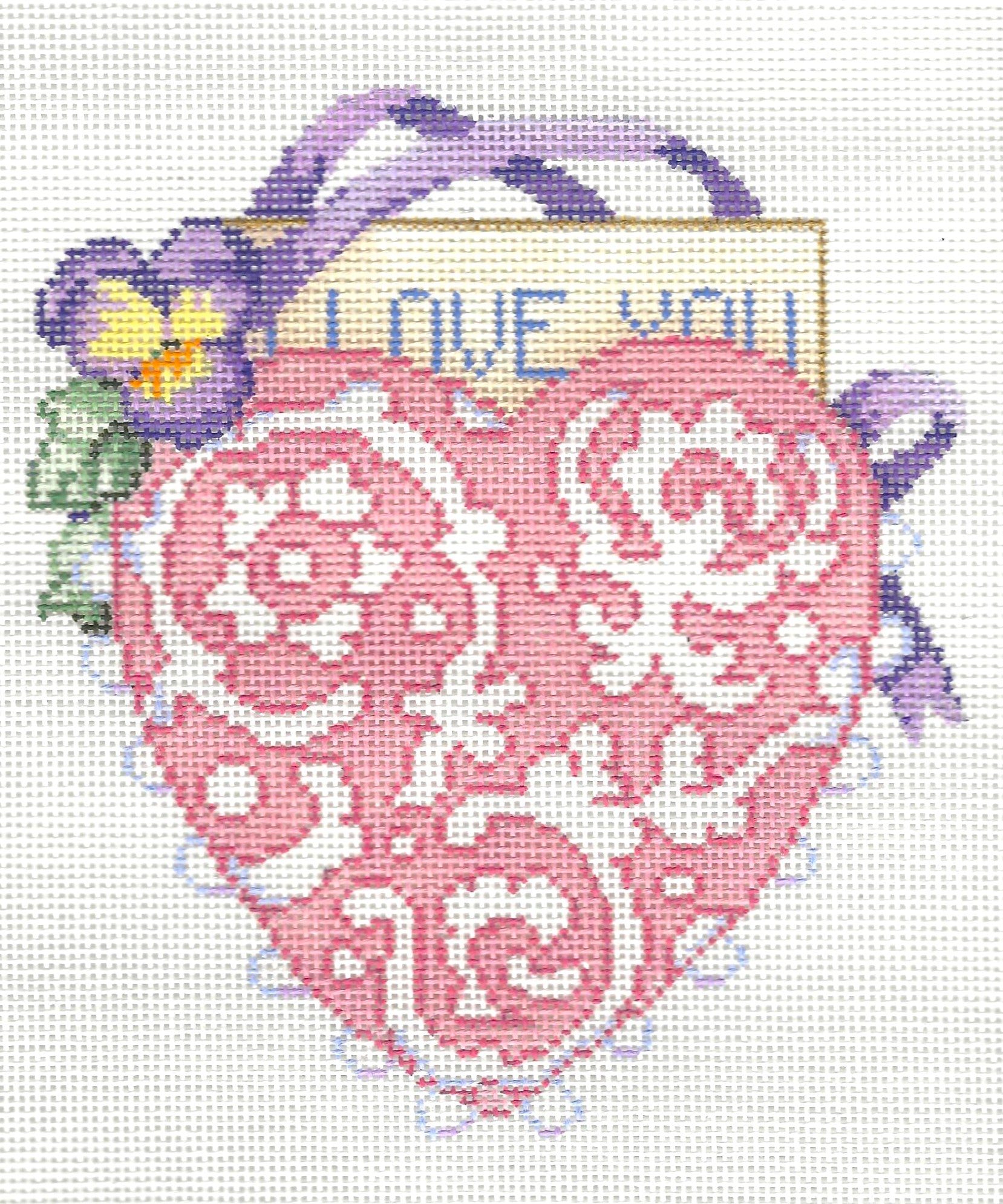 Sandra Gilmore needlepoint canvas of decorative heart with floral elements and 'I love you' text on a white background