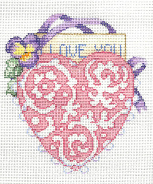 Sandra Gilmore needlepoint canvas of decorative heart with floral elements and 'I love you' text on a white background