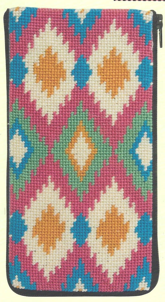 Stitch & Zip eyeglass case needlepoint canvas of ikat-pattern on a pink background.