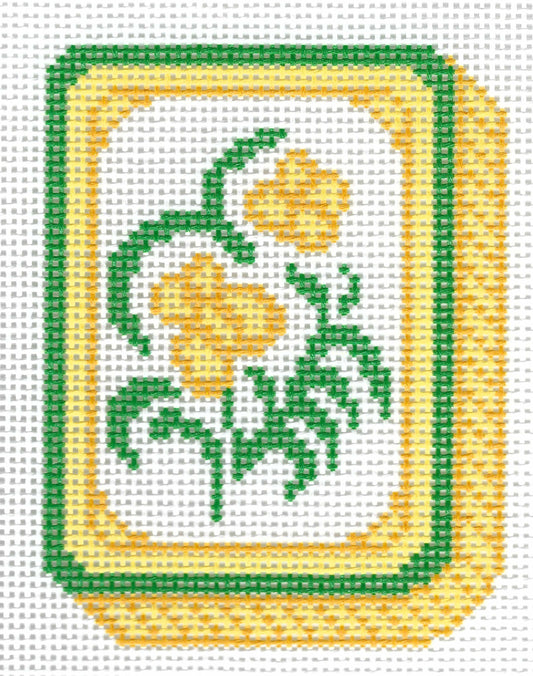 KCN Designers needlepoint canvas of a mahjong tile with a yellow flower.