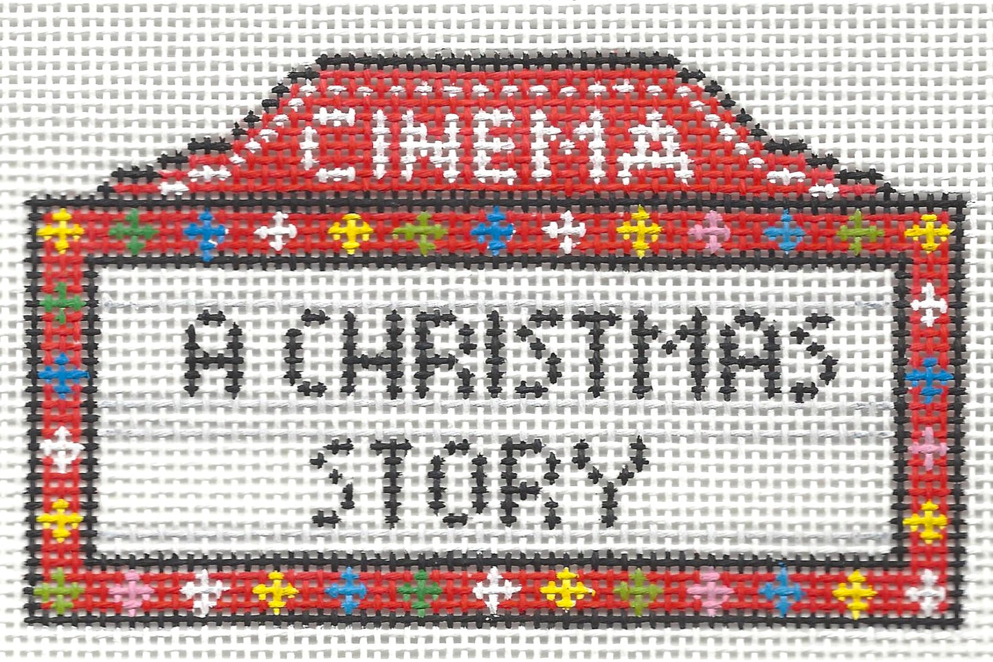 Needlepoint by Laura canvas of movie theater marquee with 'A Christmas Story' text on a white background.