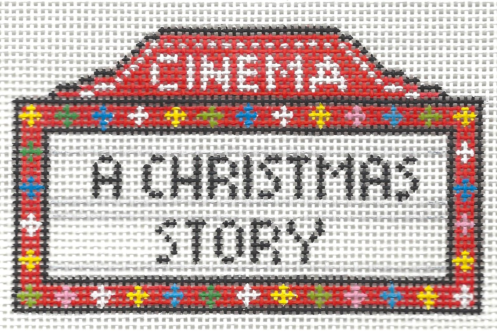 Needlepoint by Laura canvas of movie theater marquee with 'A Christmas Story' text on a white background.