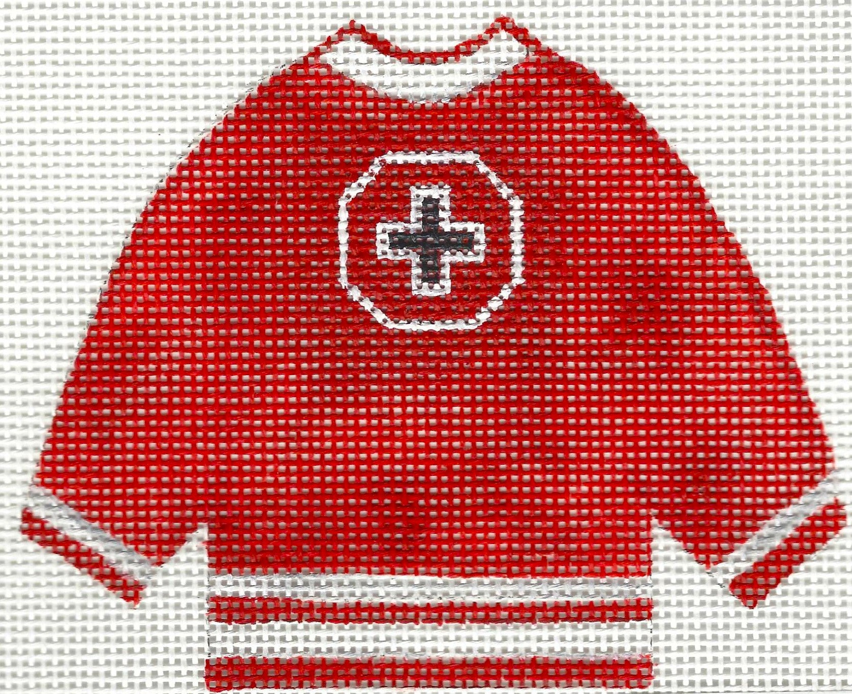 Needlepoint canvas of a red pullover Mount Michael sweater.