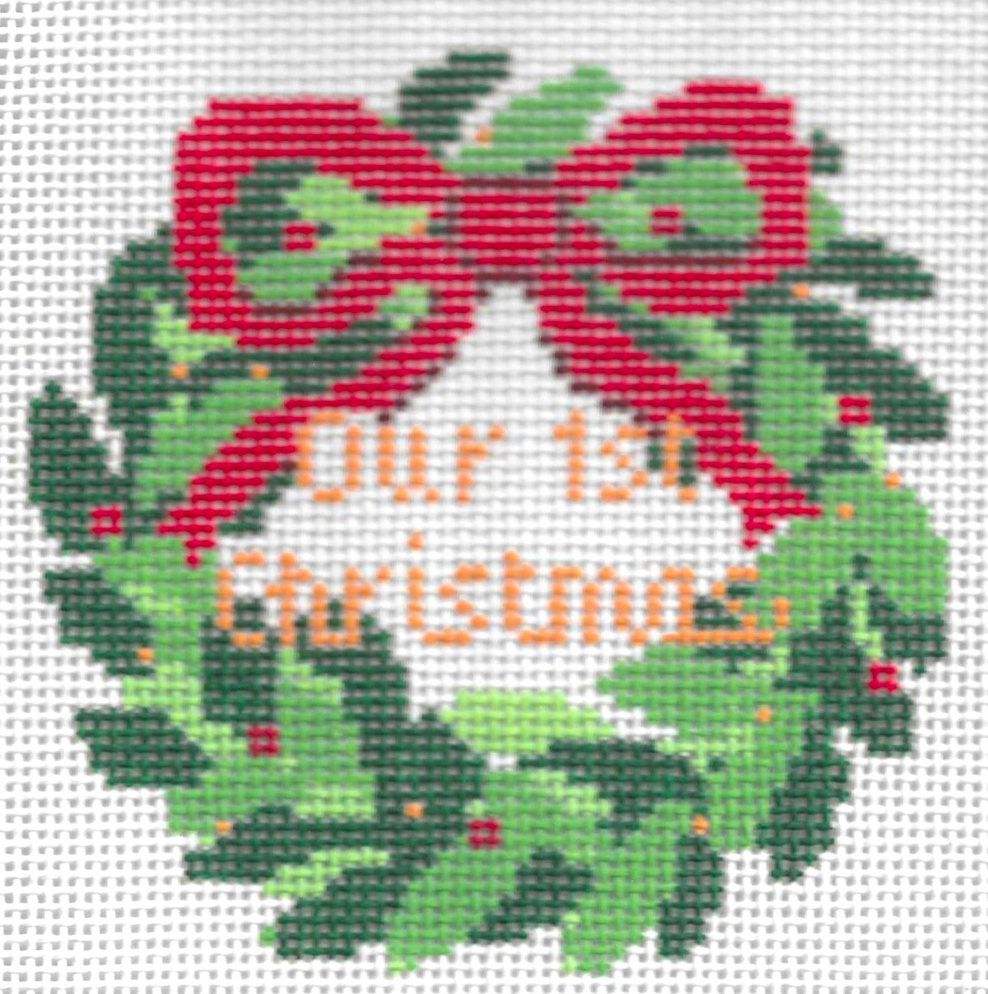 Stitch Style needlepoint canvas of Christmas wreath with red bow and 'Our 1st Christmas' text on a white background
