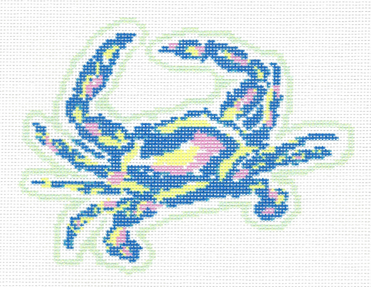 Threaded & Tipsy needlepoint canvas of a colorful crab design in blue, yellow, pink, and light green on a white background.