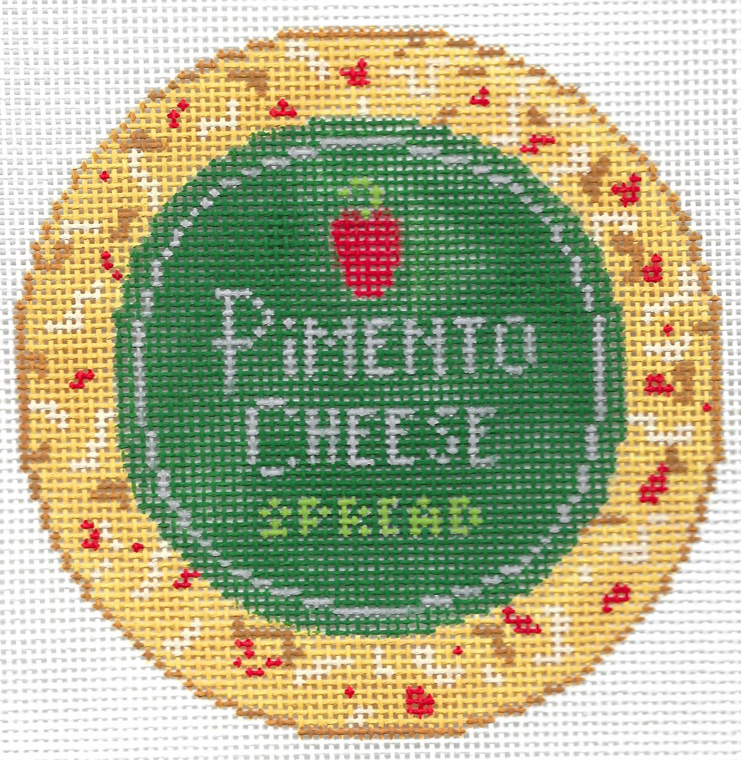 Stitch Style round needlepoint canvas of text 'pimento cheese spread' with a red pimento on a yellow, pimento cheese border.