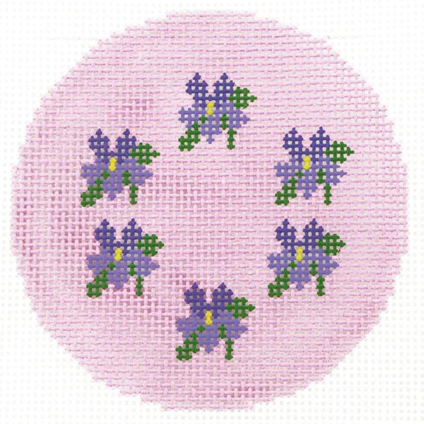 Lee's Needle Art round needlepoint canvas with purple flowers on a pink background