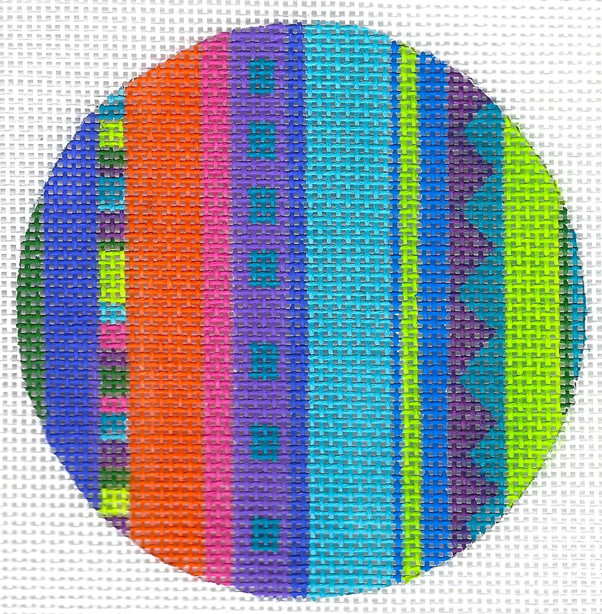 Zecca circular needlepoint canvas with multicolor patterns featuring vertical stripes in blue, purple, pink, orange, green, and yellow.