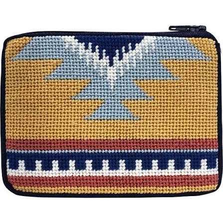Stitch & Zip coin purse needlepoint kit with a Southwestern-style geometric pattern in mustard yellow, navy blue, light blue, white, and terracotta red shown on a plain white background.
