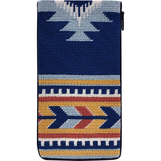 Stitch & Zip eyeglass case needlepoint kit of a textile pattern featuring a Southwestern geometric design in navy blue, white, orange, and red.