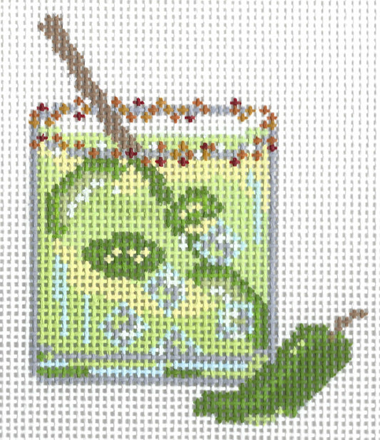 The Painted Stitch needlepoint canvas of a green margarita cocktail with a red and orange rim and jalapenos.
