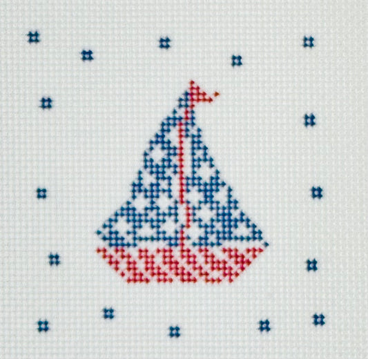 KCN Designers needlepoint canvas of a patriotic sailboat with a blue sails with white stars and a red and white striped boat.