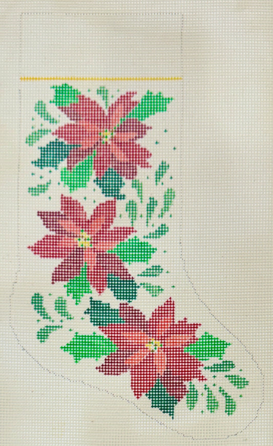 The Studio Midwest Christmas stocking needlepoint canvas featuring three red poinsettia flowers and green leaves on a white background.