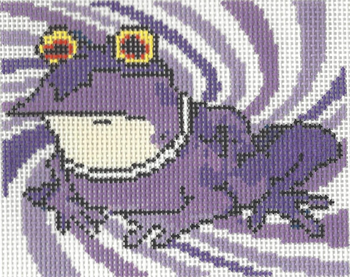 Bexar Needleworks needlepoint canvas of a purple toad with yellow and red eyes on a purple and white swirled background.