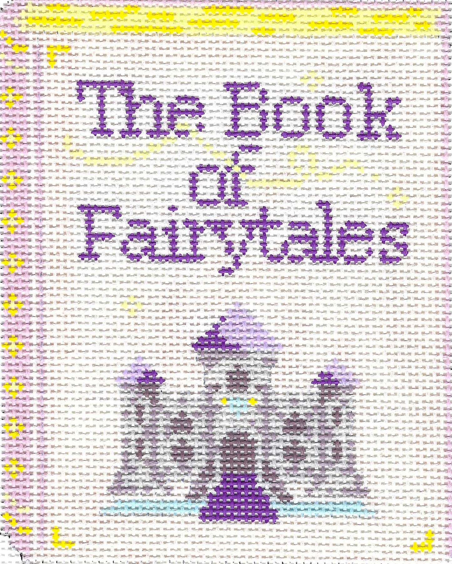 Gingham Stitchery needlepoint canvas of a book cover with a castle with 'The Book of Fairytales' text.
